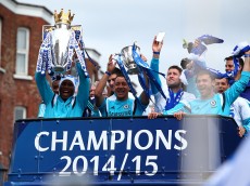 LONDON, ENGLAND - MAY 25: Didier Drogba and John Terry hold up the Premier League trophy and League Cup trophy as they exit the stadium during the Chelsea FC Premier League Victory Parade on May 25, 2015 in London, England, (Photo by Charlie Crowhurst/Getty Images)